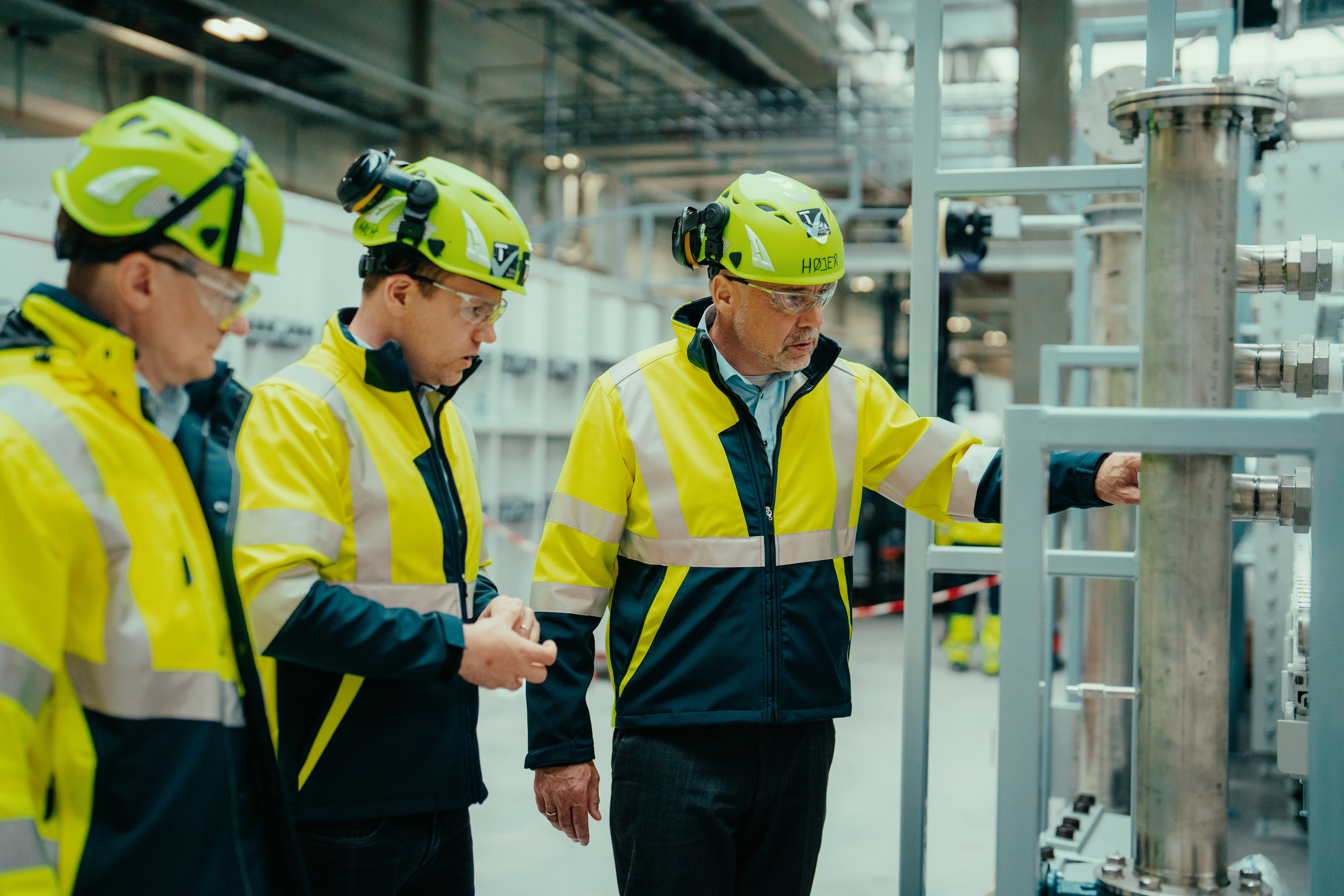 Topsoe PtX staff inspecting advanced equipment at Topsoe